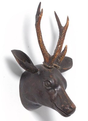 Lot 163 - A German Carved and Stained Wood Head of a Deer, inset with Roe antlers, the head 20cm from the...