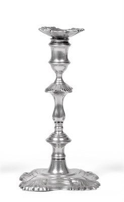 Lot 440 - A Near Pair of George II Cast Silver Candlesticks, John Cafe, London 1754, on quatrefoil bases with