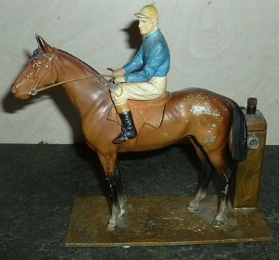 Lot 33 - A Spelter Strike-Lite Table Lighter in the Form of a Horse and Jockey, the bay horse with jockey in