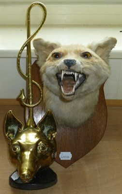 Lot 58 - A Taxidermy Fox Mask by C.P. Dunton, mounted on an oak plaque; A Cast Iron and Brass Door Stop,...