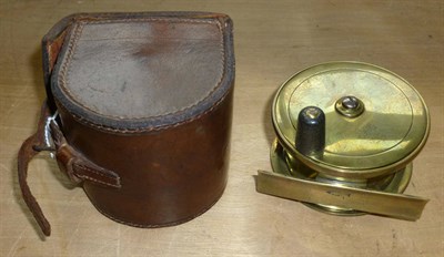 Lot 114 - A Farlow's 3inch Brass Trout Reel, with fat black handle, engraved makers name 'Chas Farlow &...