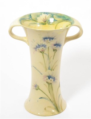 Lot 481 - A William Moorcroft Twin Handled Lustre Cornflower Vase, c.1907-10, green painted signature,...