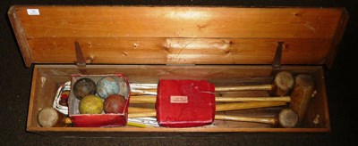 Lot 15 - A Boxed Croquet Set, containing four wooden mallets, balls and metal hoops, in a pine box