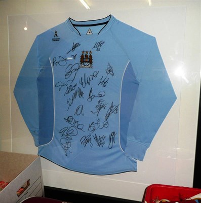 Lot 29 - A Signed 2008 Manchester City Shirt, with felt pen signatures, mounted in an ebonised frame