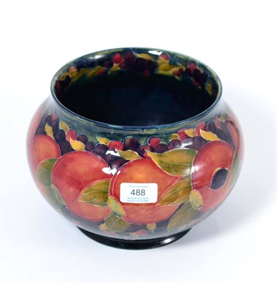 Lot 488 - A William Moorcroft Pomegranate Pattern Jardiniere, on a blue ground, green painted signature,...