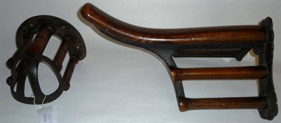 Lot 84 - A Victorian Irish Walnut and Cast Iron Wall Mounted Saddle Rack, cast with diamond registration...