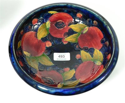 Lot 493 - A William Moorcroft Pomegranate Pattern Pedestal Bowl, on a blue ground, impressed facsimile...