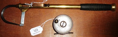 Lot 123 - A 2 1/2-Inch Brass Platewind Reel, with black handle, brass foot, original line; A Telescopic Brass