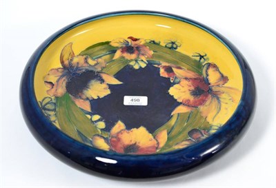 Lot 498 - A William Moorcroft Frilled and Slipper Orchids Pattern Footed Bowl, with everted rim, on a...