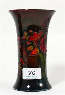 Lot 502 - A Walter Moorcroft Flambé Orchid and Spring Flowers Pattern Trumpet Vase, impressed factory...