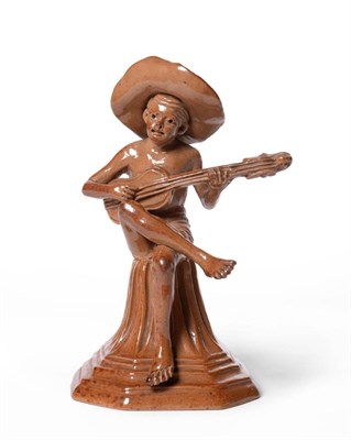 Lot 504 - A Doulton Lambeth Salt Glazed Stoneware Merry Musician Figure, by George Tinworth, part moulded and