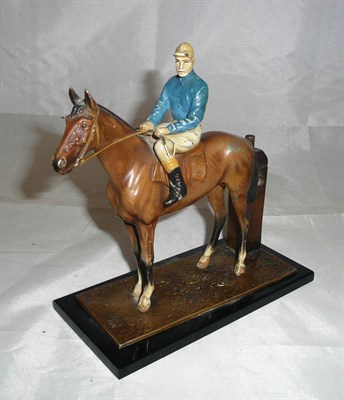 Lot 38 - A Spelter Racehorse and Jockey Strike-Lite Table Lighter, the horse in brown, the jockey in...