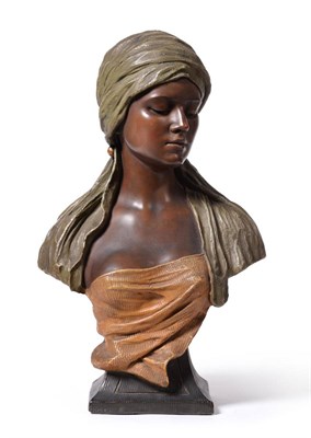 Lot 522 - A Goldscheider Bust of an Arab Woman, circa 1900, by D.Rochella, model No.1340, wearing a green...