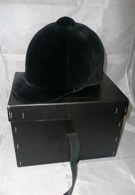 Lot 70 - A Black Velvet Hunting Cap by Lock & Co., London, size 7, in original box.