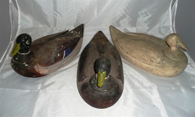 Lot 74 - Three Wooden Decoy Ducks, two with painted decoration, one cream painted, each of hollow form,...