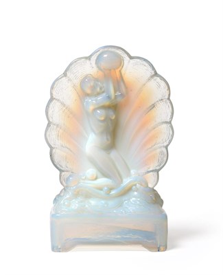 Lot 530 - A Sabino Opalescent Figural Table Lamp, modelled as a kneeling nude inside a shell, holding a...