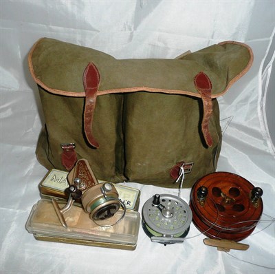 Lot 117 - A Canvas Tackle Bag, containing an Allcock brass centrepin reel, Shakespeare 'Speedex' reel,...