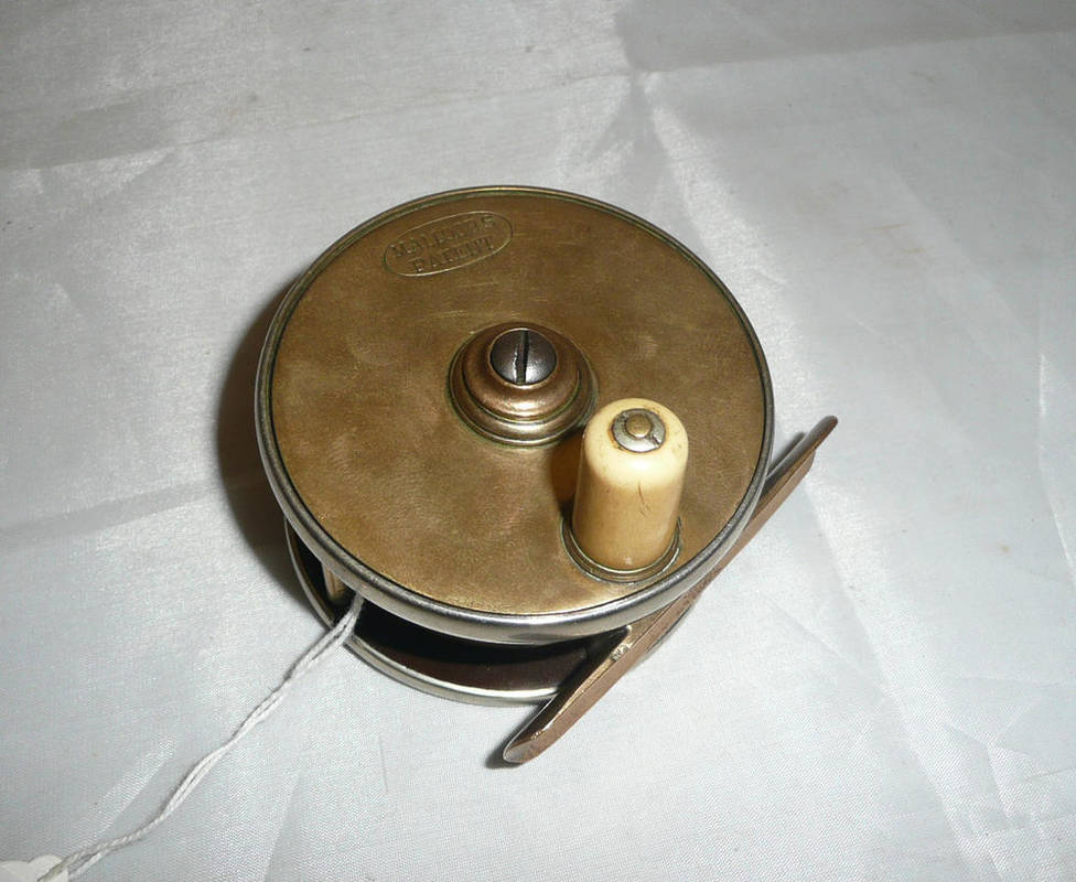 Lot 168 - A Malloch 2 3/4-Inch Sun and Planet Reel, with brass face, ivorine handle, ebonite back, nickel...