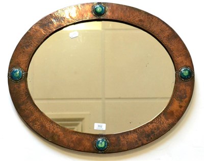 Lot 552 - An Arts & Crafts Mirror, the oval beaten copper frame with four Ruskin pottery blue/green...