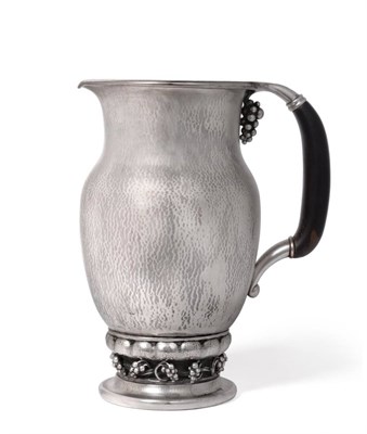 Lot 554 - A Danish Silver Grape Pattern Pitcher, designed by Georg Jensen in 1925, 407B, of baluster form, on