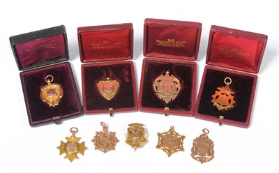 Lot 4 - Nine Victorian and Later 9ct Gold Sporting Fob Medallions Awarded to Robert Shaw, four cased,...