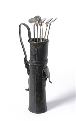 Lot 18 - A Hermes Miniature Leather Golf Bag, containing six silver plated cocktail stirrers in the form...