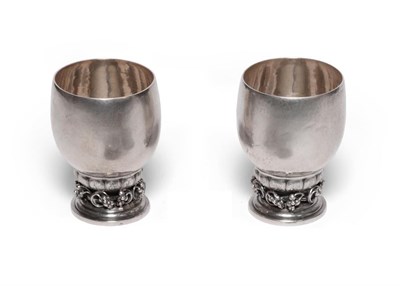 Lot 557 - A Pair of Danish Silver Grape Pattern Beakers/Wine Cups, designed by Georg Jensen in 1928,...