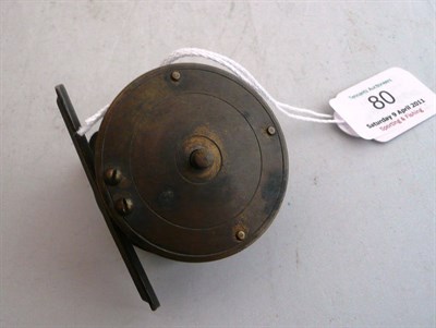 Lot 80 - A 2inch Brass Crankwind Winch by Pape, with slim ebony handle on curved brass arm, brass foot