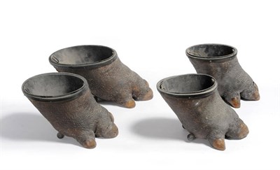 Lot 195 - African Rhinoceros: Two Pairs of Metal Mounted Rhinoceros Foot Wine Coolers, circa 1910-20,...