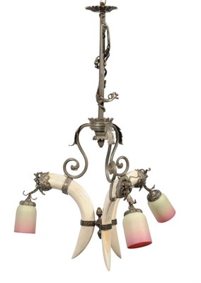 Lot 286 - A Hippopotamus Tusk Mounted Three-Light Chandelier, late 19th century, the upper reeded stem...