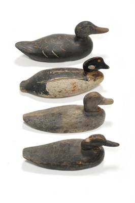 Lot 321 - A Group of Four North American Carved Wood, Polychrome Painted and Lead Weighted Decoy Ducks,...