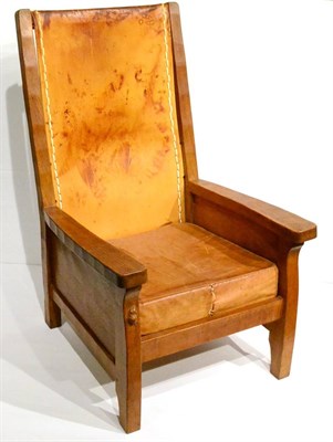 Lot 597 - A Robert  "Mouseman " Thompson Oak Smoker's Chair, with slung leather back and cushion, solid seat