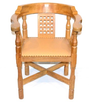 Lot 600 - A Robert  "Mouseman " Thompson Oak Monk's Chair, with curved back and shaped arms, over three...