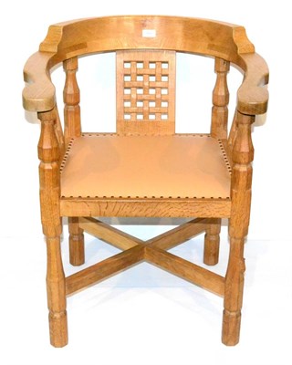 Lot 601 - A Robert  "Mouseman " Thompson Oak Monk's Chair, with curved back and shaped arms, over three...