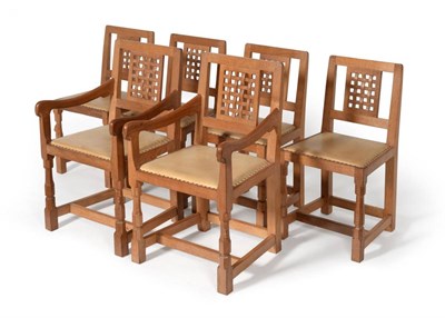 Lot 605 - A Set of Six (4+2) Robert  "Mouseman " Thompson Oak Lattice Back Chairs, tan hide seats, on two...