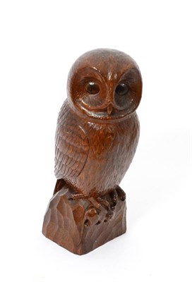 Lot 608 - A Robert  "Mouseman " Thompson Carved Oak Owl, carved as a standing owl holding a mouse in its...