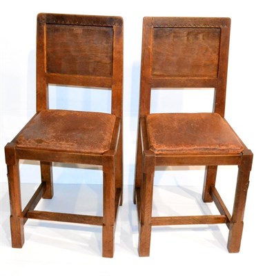 Lot 625 - A Pair of Derek  "Lizardman " Slater Oak Panel Back Dining Chairs, with carved triangular top rail