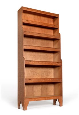 Lot 638 - An Arthur Simpson of Kendal Oak Waterfall Bookcase, with hinged dust flaps, on shaped supports,...