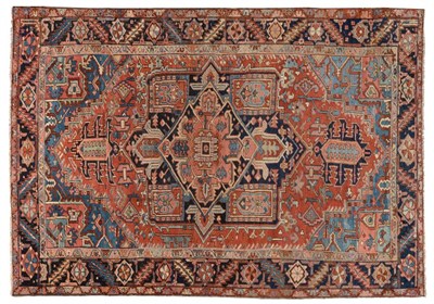 Lot 831 - Heriz Carpet Persian Azerbaijan, late 19th/early 20th century The brick red field of angular...