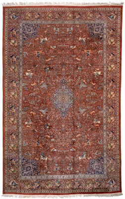 Lot 841 - An Indian Carpet The terracotta field depicting a hunting scene centred by a pole medallion...