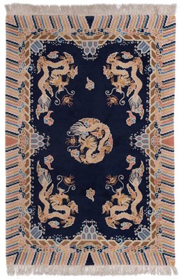 Lot 857 - Good Chinese Rug The deep indigo field with central roundel of an Imperial dragon chasing a...