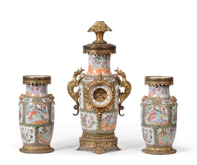 Lot 885 - A Cantonese and Ormolu Mounted Striking Mantel Clock Garniture, 19th century, surmounted with a...