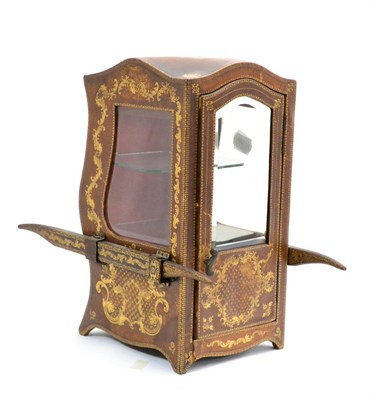 Lot 935 - A Leather Table Top Display Cabinet, in the form of a sedan chair, with gilt tooled foliate and...