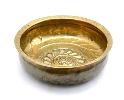 Lot 946 - A Brass Alms Bowl, probably Nuremberg, late 16th century, with central roundel within a wrythen...