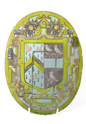 Lot 949 - A Stained Glass Armorial Oval Panel, 17th century, painted in colours with an armorial within a...