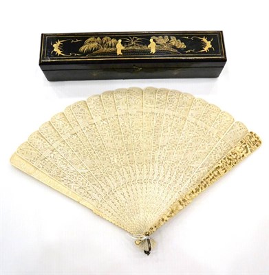 Lot 952 - A Canton Carved Ivory Brise Fan, 19th century, the guards carved in deep relief with figures...