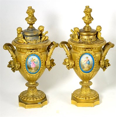 Lot 953 - A Pair of French Gilt Metal Urns and Covers, late 19th century, the domed covers with bust...