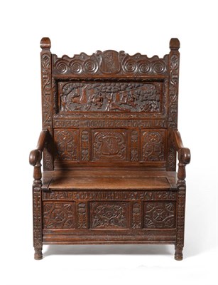 Lot 973 - An English Joined Oak Carved Settle, named Charles and Dorothea Helena Stanley, the carved top rail