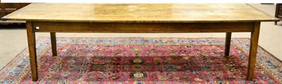 Lot 976 - An Early 19th Century Oak Farmhouse Table, the four-plank top with cleated ends above a plain...