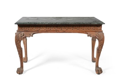 Lot 982 - A Carved Pine Sideboard Table, the later rectangular maurin green marble top over a Greek...